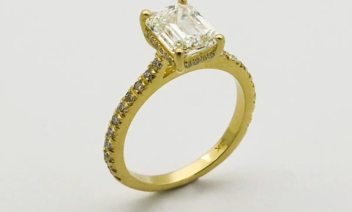 gold ring on white surface